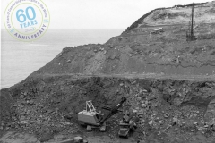 Harman excavator loading heavy rock - Cape Grant Quarry