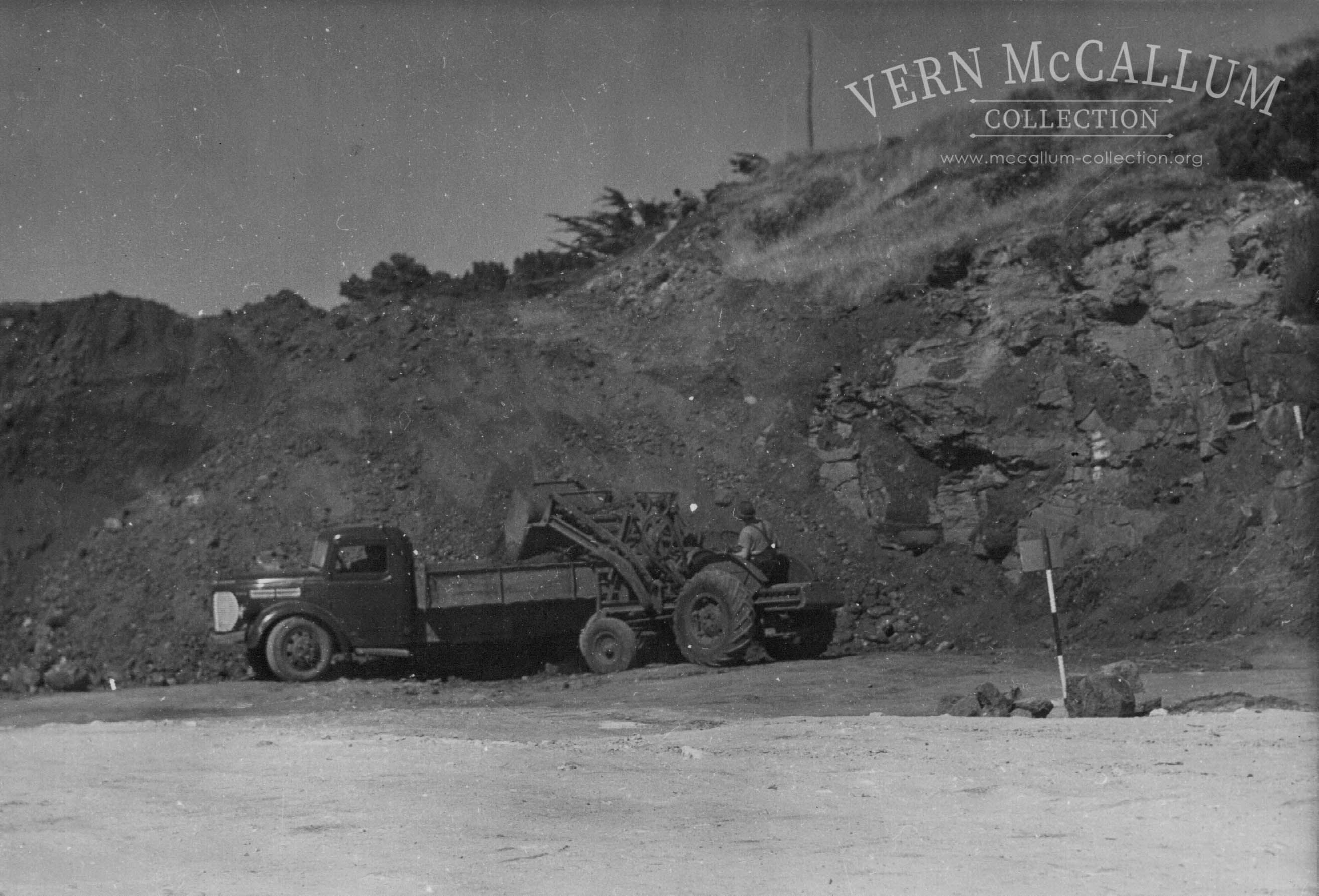Loading of truck. Portland port area. George Wallace on the loader, a Fordson Detroit pre 1928 Moore cable loader.