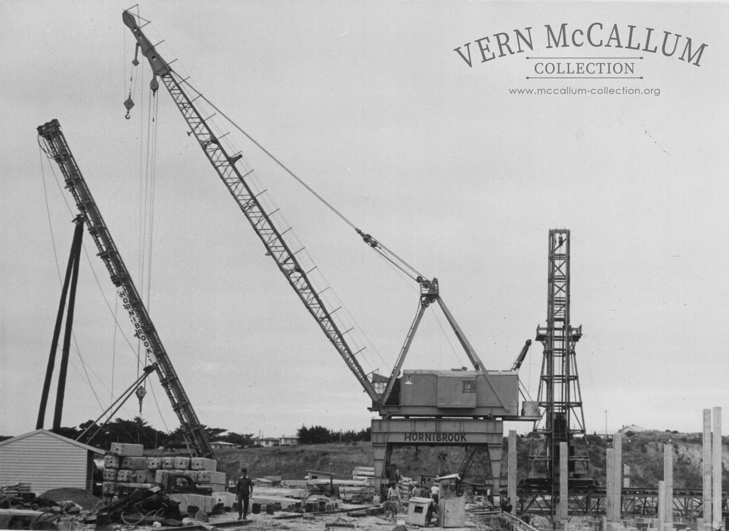 Hornibrook crane ready to lift a pile around to the pile driver  on the K. S. Wharf. Portland.