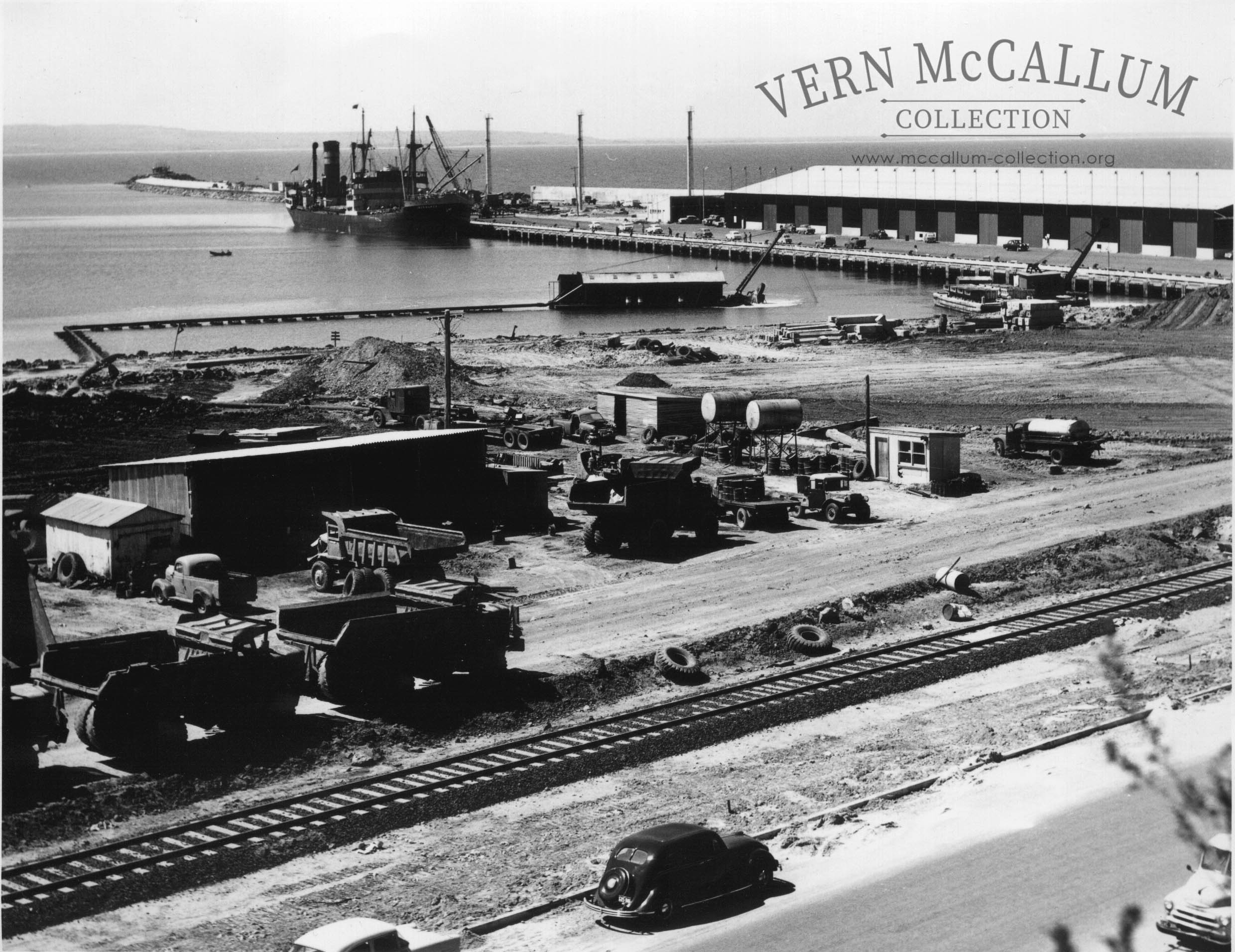 K. S. Wharf, Portland. and the workshop. With a ship unloading.