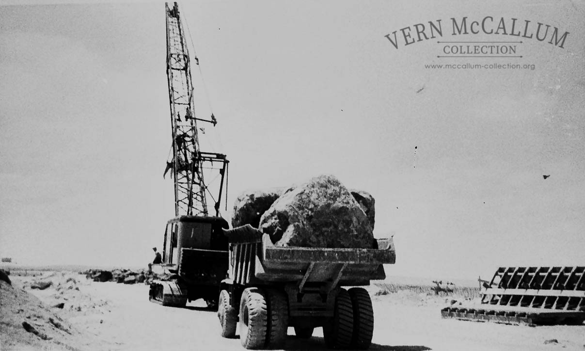 .Construction of the K S Anderson wharf .The rocks were placed with the grab on the  Osgood crane.Note the size of the stone .