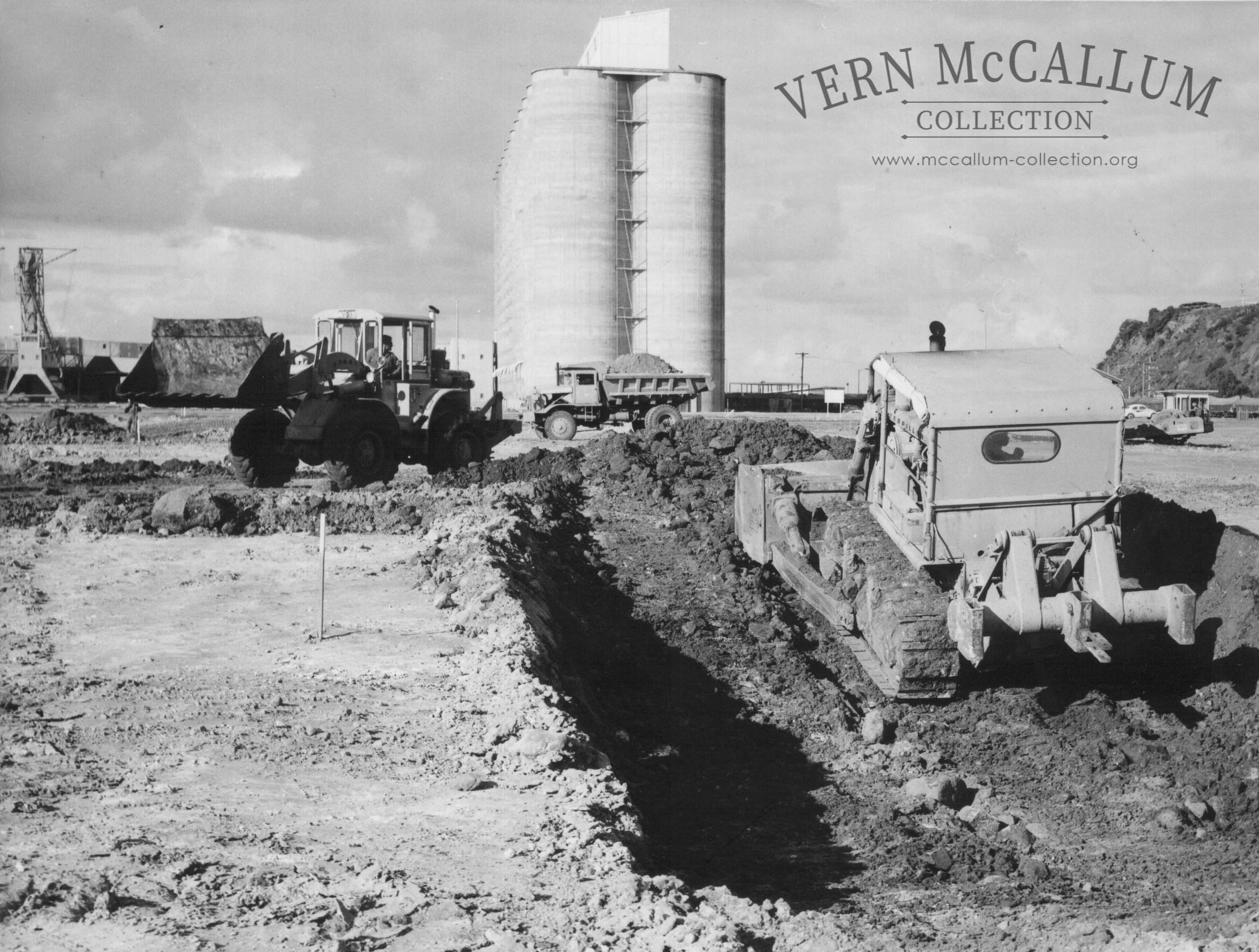 Preparing foundation for horizontal wheatshed with Cat D7 dozer and Cat 944 loader.