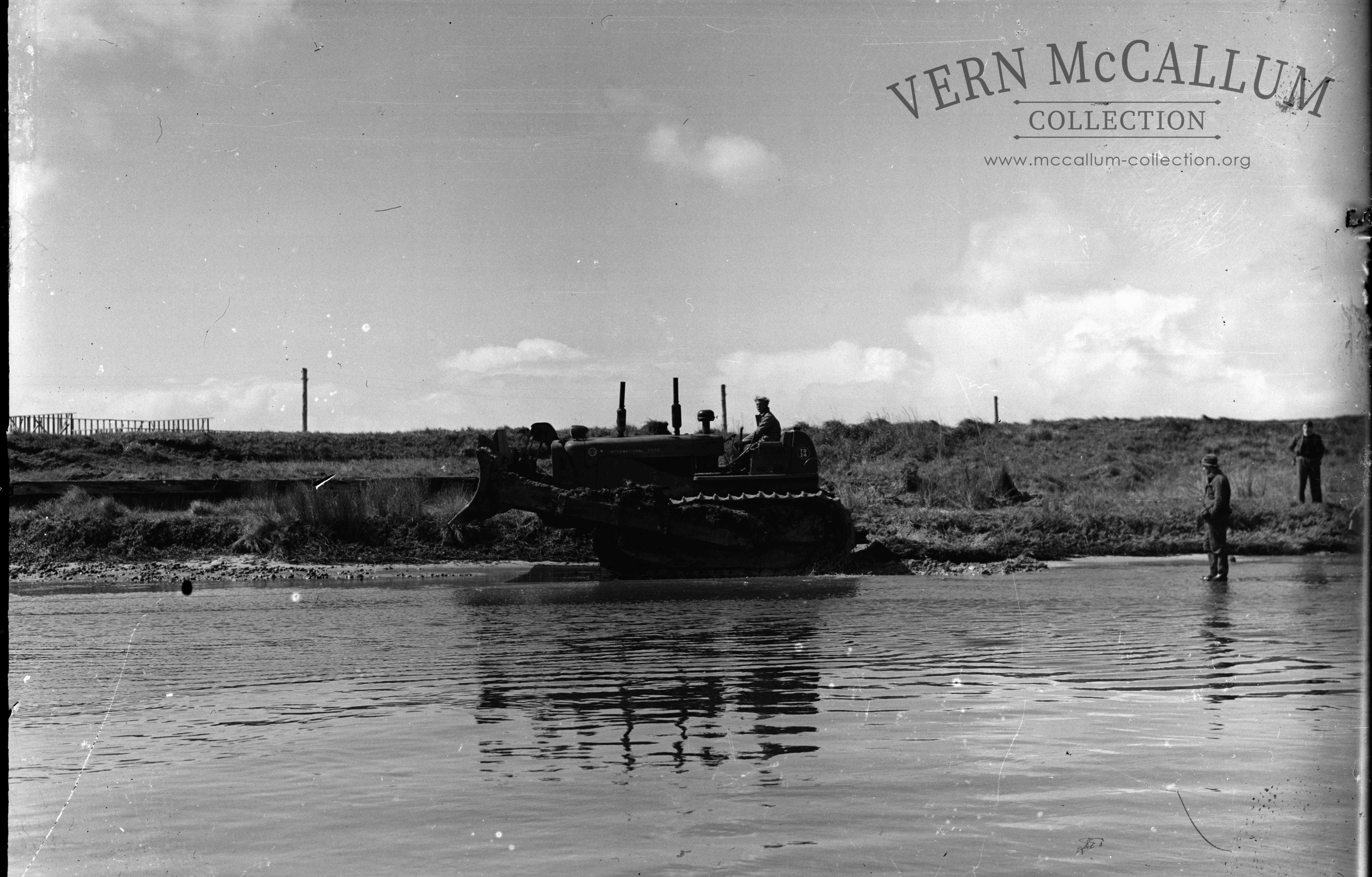 An International TD 24 dozer at work  at the Portland harbour. Circa 1950.
 scanned From a glass negative.