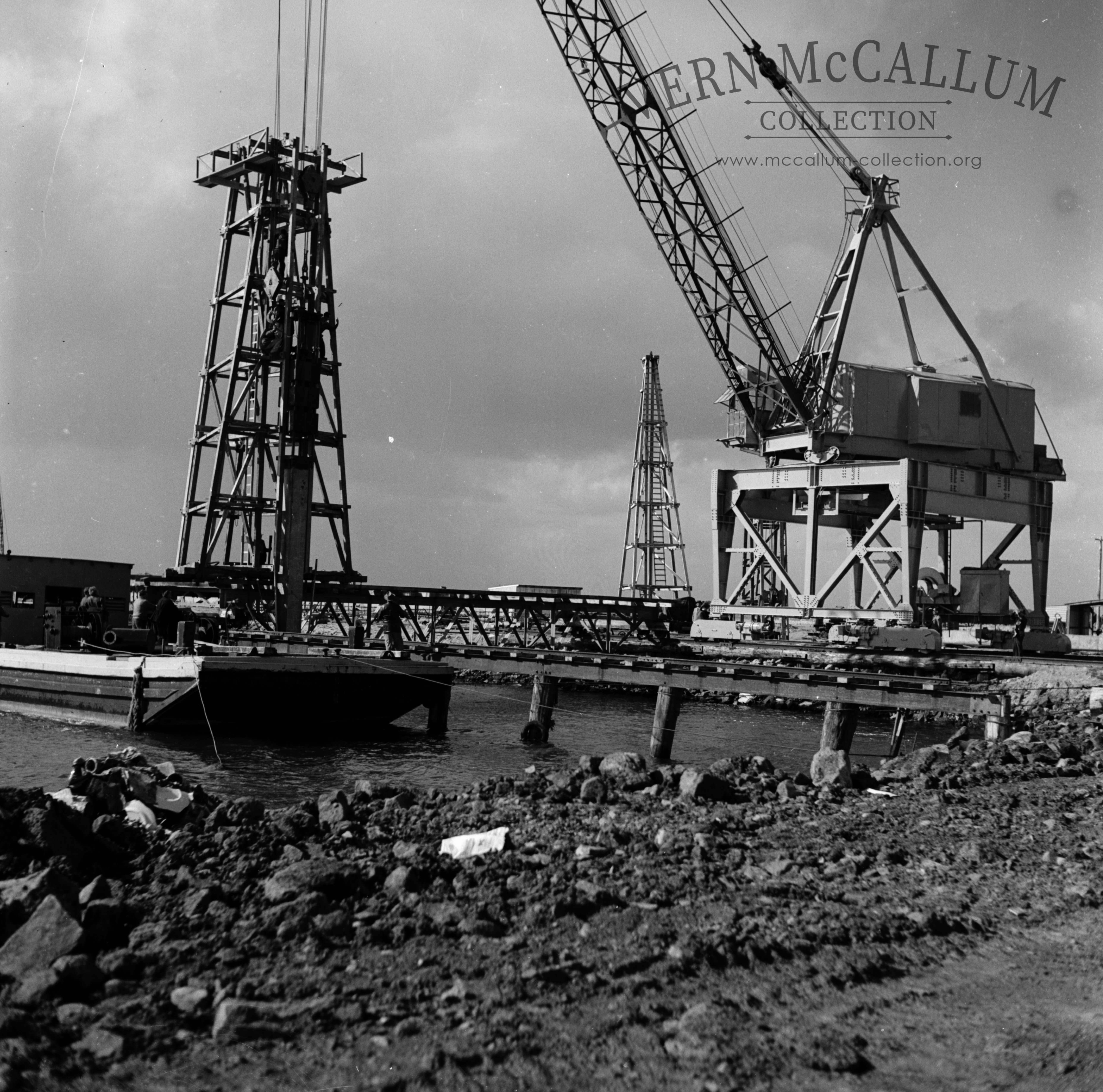 Driving timber piles for the crane line on the K S Anderson wharf.