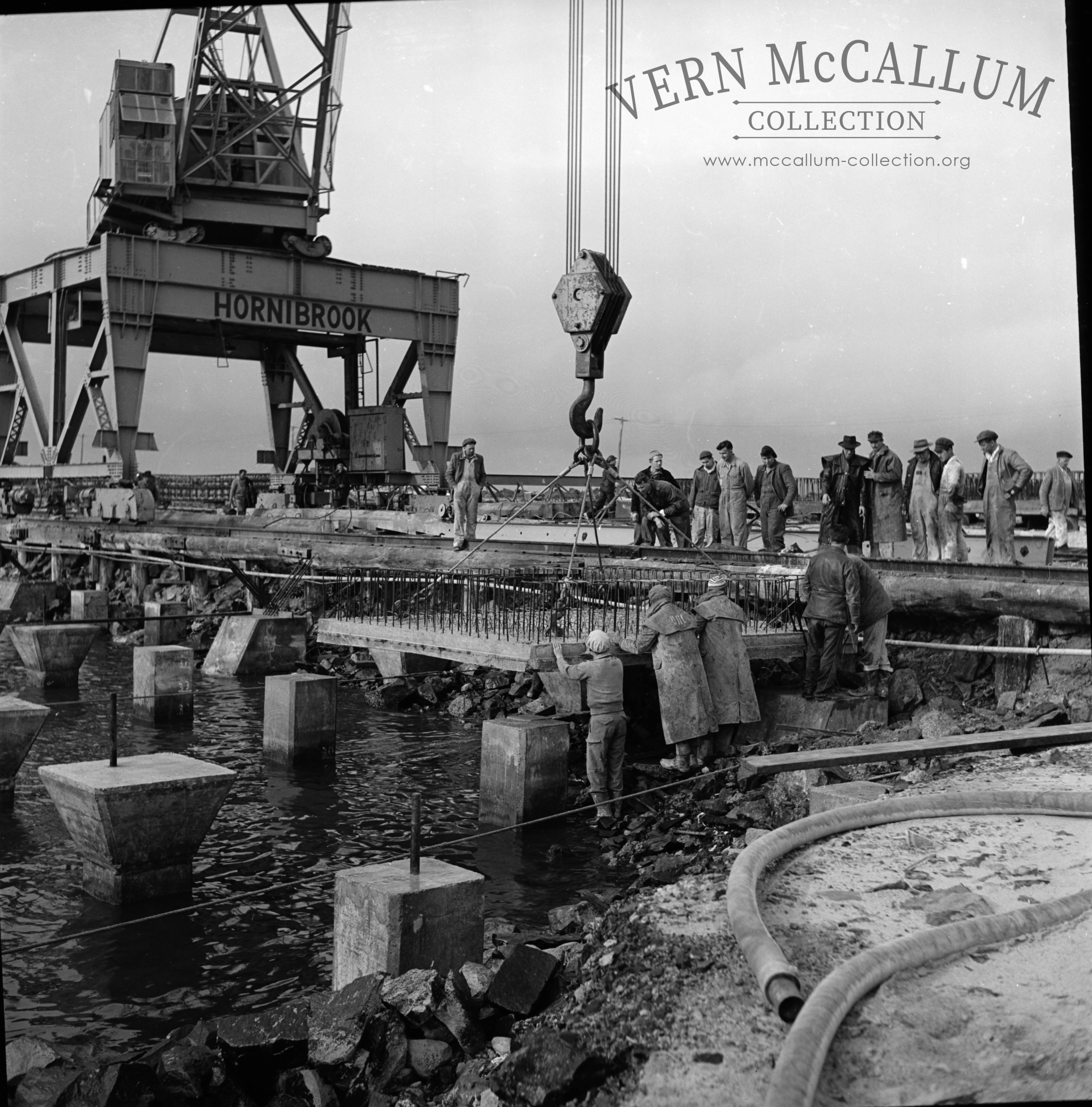 Laying the first slab on the K S Anderson wharf.
