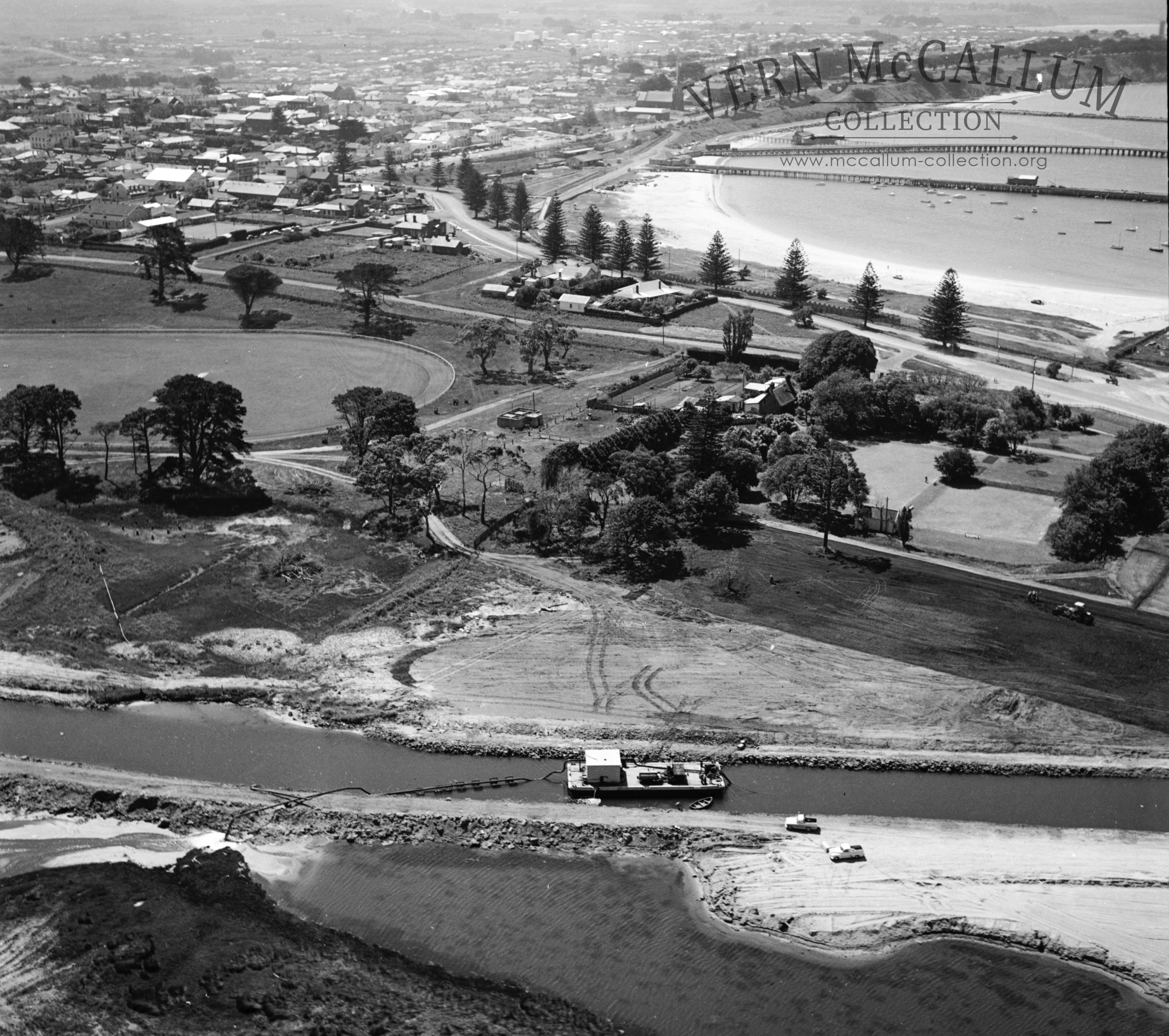 Dredging the canal with the suction dredge behind the gardens,