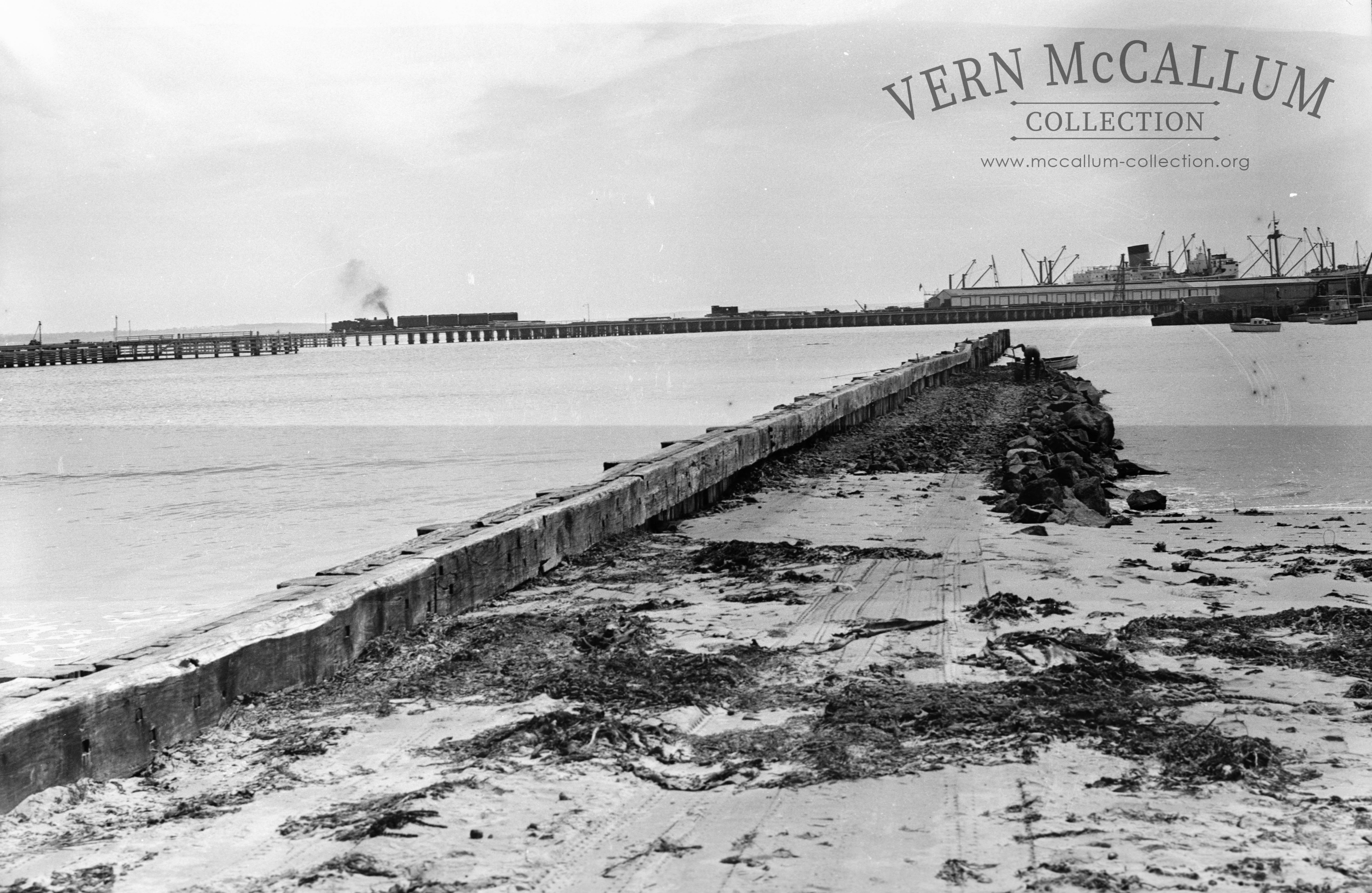 Constructing the groyne later the trawler wharf note the train on the railway pier.
