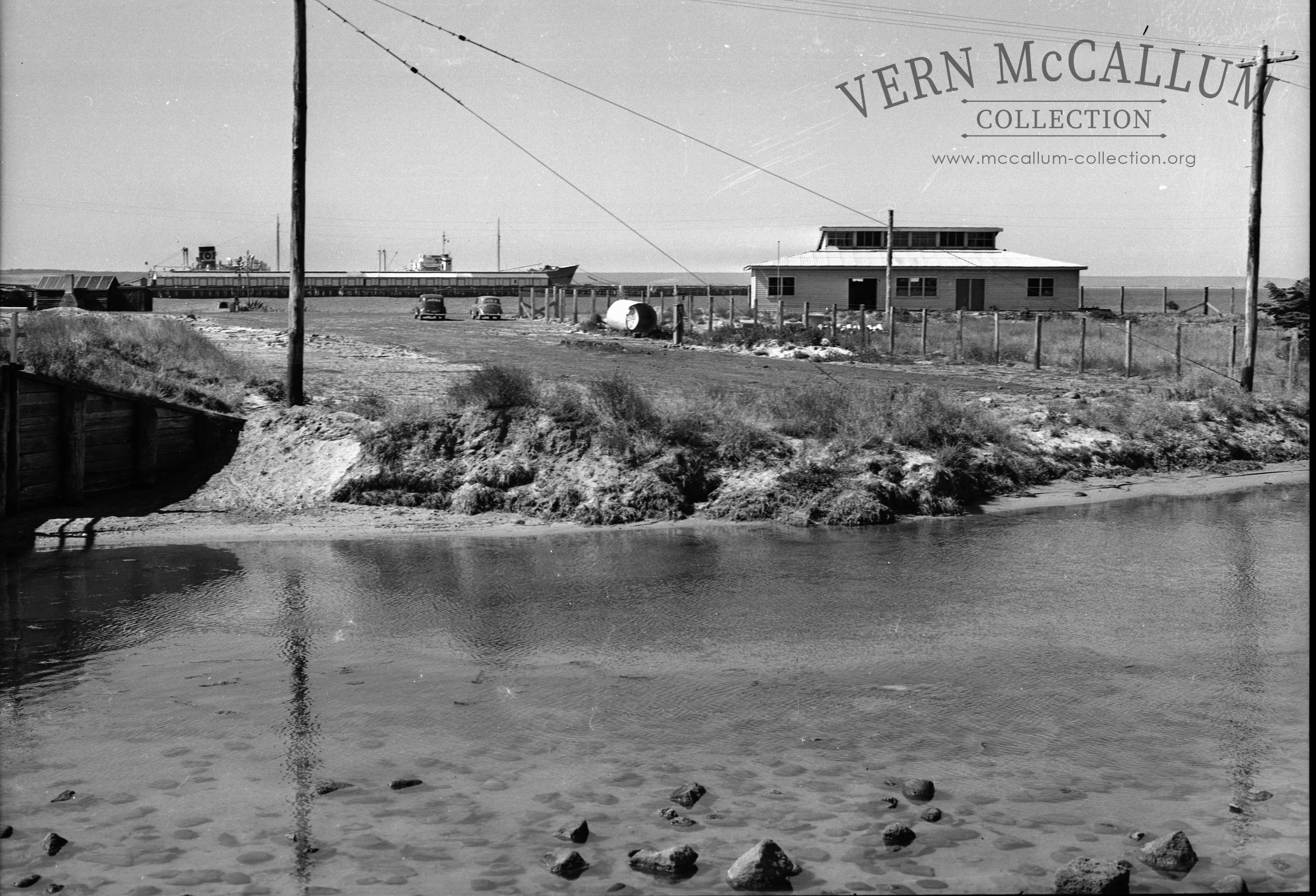 Construction of the store building.Note the hut in the left side of this photo.