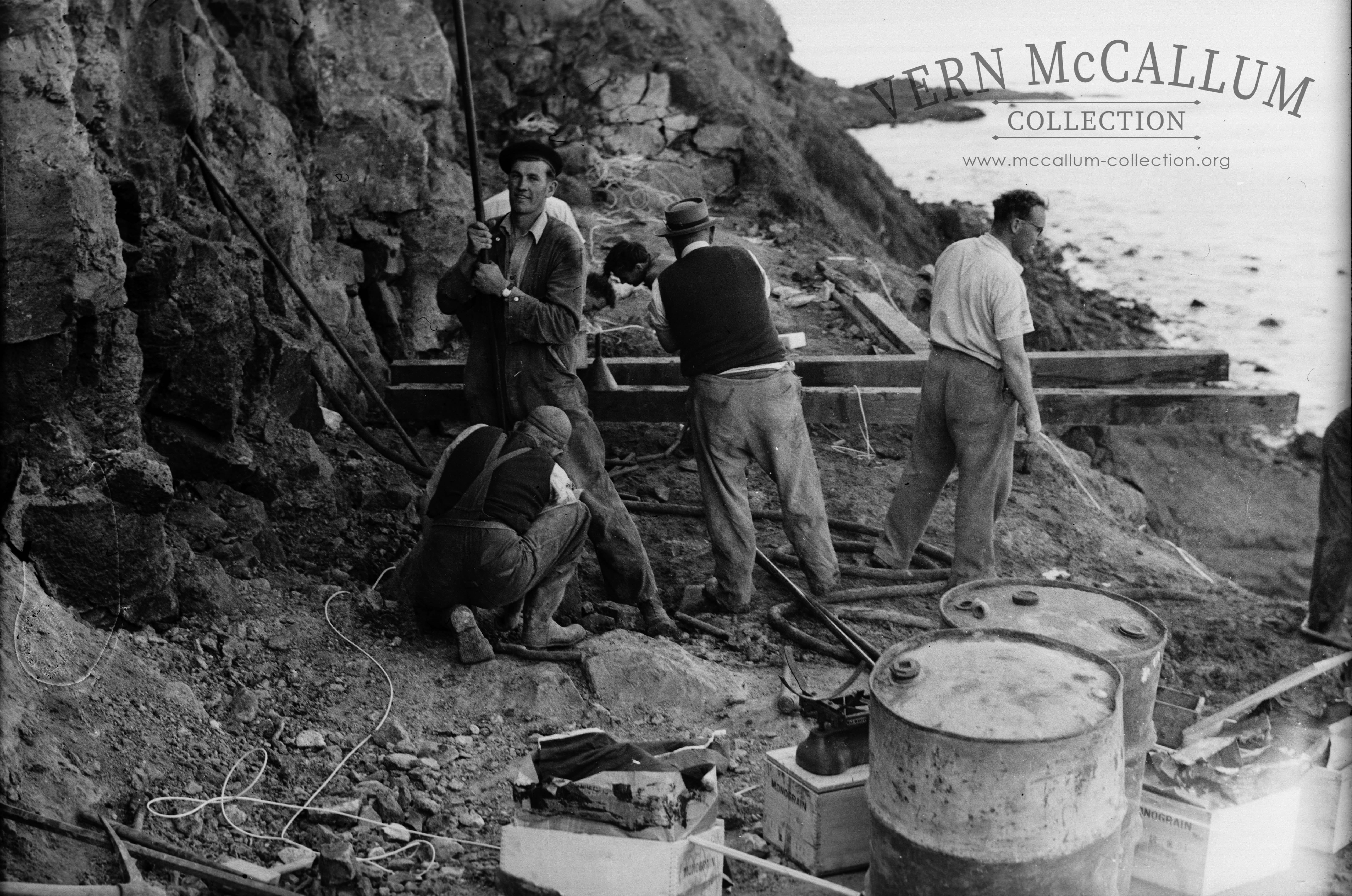 Setting up to drill for a blast part way up the rock face at Blacknose quarry.