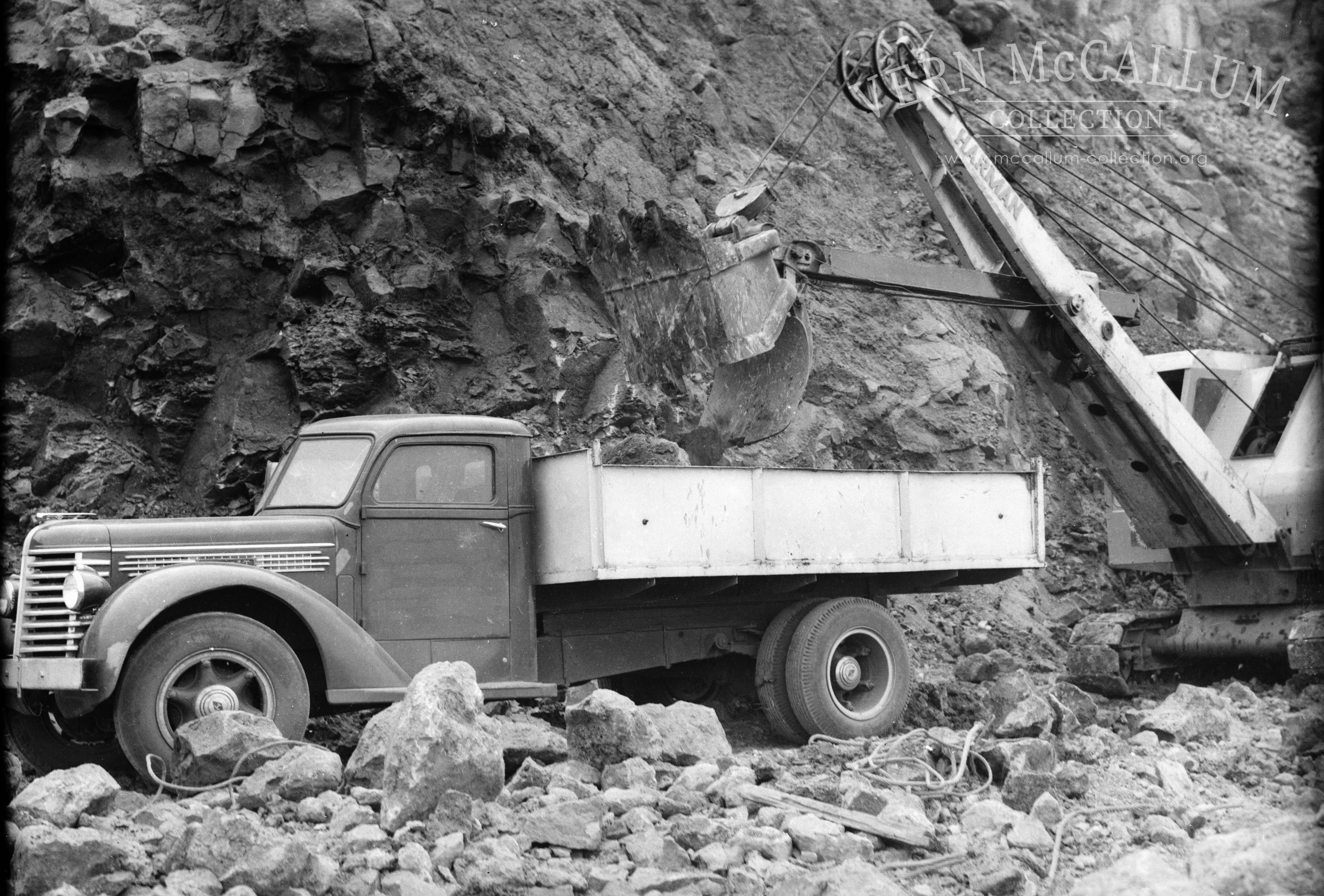 Loading  truck with dirt and rocks.