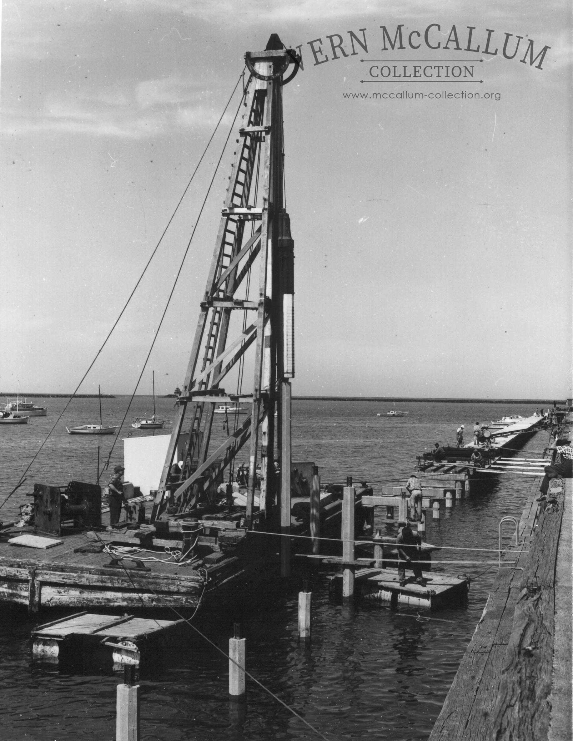 A pile driver at work on the pier at Portland