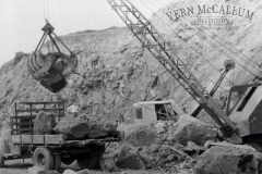 Loading rocks with a grab for the wharf.  Photo from the Peter Burch Collection.