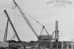 Hornibrook crane ready to lift a pile around to the pile driver  on the K. S. Wharf. Portland.