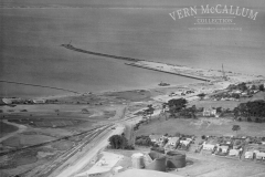 Aerial shot of Portland harbour and the Shell black oil tanks in the foreground.