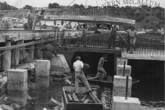Work safety!! Working on port area, Portland. Hornibrook workmen placing deck slabs for the K. S. Anderson wharf.