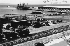 K. S. Wharf, Portland. and the workshop. With a ship unloading.