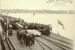 Official Opening of the New Pier, February 13th, 1902.
Mr K.S. Anderson suggests that the following people were probably present, at the Official Opening by Hon W. McCulloch --
The Mayor of Portland, Cr Wm Hanlon.
Councillors: (Dr) Levis, E. Adams, Wm Heaney, E.W, Harvey, G.H. Tulloh, J. Wiltshire, Ben Davis, W.L. Gray.
Town Clerk and Surveyor, Mr T.E.C. Henry.
Shire President,
Shire Secretary, Mr T. Tulloh and Shire Engineer, Mr C.C.P. Wilson.
Harbour Master, Pilot, of Portland, Captain Beaumont.
Mr Samuel Winter Cooke of "Murndal" elected 1901 as Member for Wannon.
Mr Ewan Cameron M.L.A (Re-elected 1900) Member for Portland, 1902.
Mr H.N.Reid, Manager of Freezing Works.
Mr H.J.M. Campbell, later member for Portland.
The Captain of the "Gulf of Siam" in port at the time.
Mr W.P. Anderson, Agent for the vessel.
The local Battery of Portland Militia, 1 officer & 26 men. Probably Major Hawkins.
Rear Admiral Beaumont of the "Royal Arthur", probably inspecting the guard. There were 5 vessels of the Australian Squardron in port.
Town Band.
Local Police.
Local Clergymen.
Identification - Mr H.J. Campbell (with beard) shaking hands with tall man (centre). Cr Wm Hanlon, short man with beard, hands on hip on West of Platform.The group nearest the camera probably councillors of borough, President, Secretary and Engineer of Shire and Mr T.E.C. Henry (town clerk).
The flag at the right is the Flag of the British Navy.
In background - All Saints Church, Loreto Convent, Victoria House, The Benevolent Asylum.