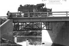 Building the port, putting a heavy weight over the canal bridge (a loaded Euclid) to test the bridge.Photo courtesy Geoff Blackman.