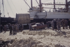 Unloading a huge machine, a generator for the paper mill at Millicent, at the Portland port.