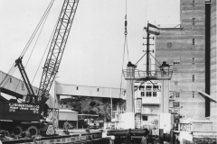 Loading the oil rig tender boats.using C J Robertson cranes .