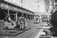 Loading bags of wheat.K.S. Anderson Wharf.