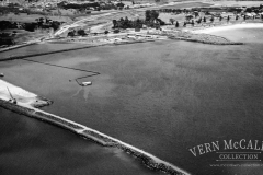 View of the port during construction. Sand was pumped into the area that had been closed off with a rock wall to reclaim a large area for the port buildings etc.