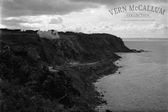 Blasting rock for the harbour.
This photo is from a glass negative.