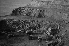 Excavating rock at Cape Grant to be carted to the port with the Euclid trucks.