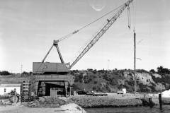 Hornibrooks crane lifting piles at the harbour.