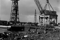 Driving timber piles for the crane line on the K S Anderson wharf.