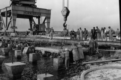 Laying the first slab on the K S Anderson wharf.