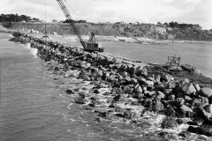 Placing stone on the outside of the K S Anderson wharf the large stones were individually placed using the grab seen in this photo.