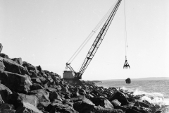 Placing stone on the main breakwater.