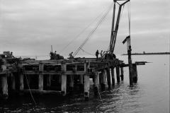 Demolishing the old pier.