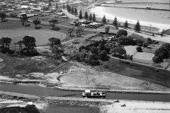 Dredging the canal with the suction dredge behind the gardens,