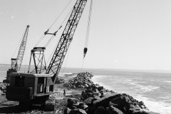 Osgood placing a stone on the outside of the K S Anderson wharf.