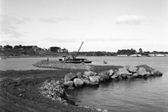 The Harman mounted on the dredge and dredging in the harbour.
