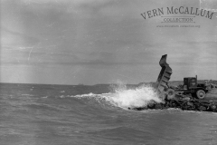 Dumping rock into the sea on the main breakwater.